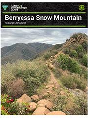 Front cover of the report displaying a trail in a mountain. 