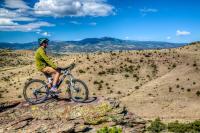 A mountain biker overlooks the San Luis Valley.