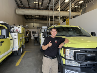 Luis Lopez in front of BLM fire vehicle
