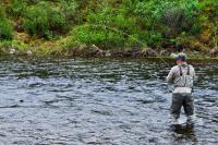 A man in the river, fly fishing on the Tangle River