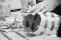 A basket being hand-weaved. 